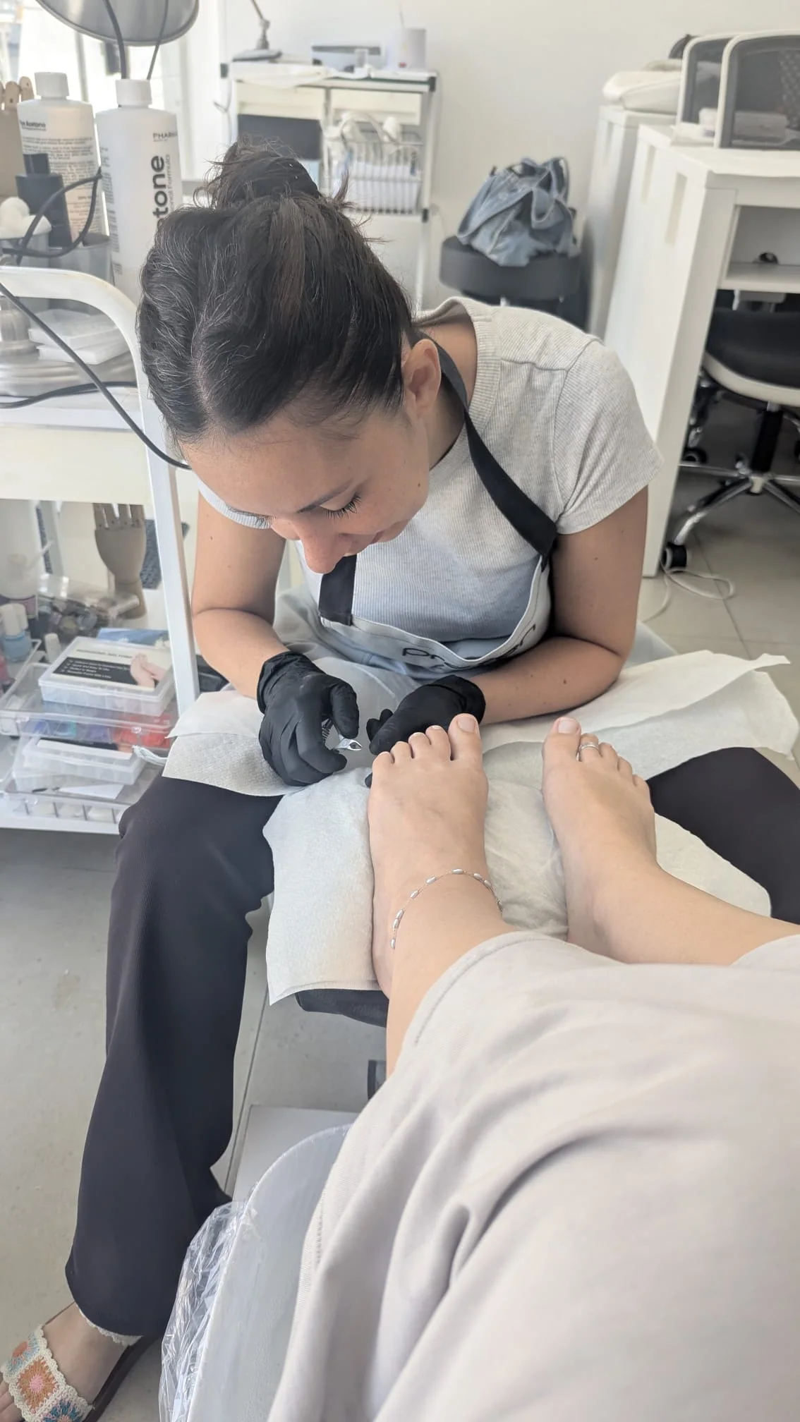 Orli performing a pedicure in the studio